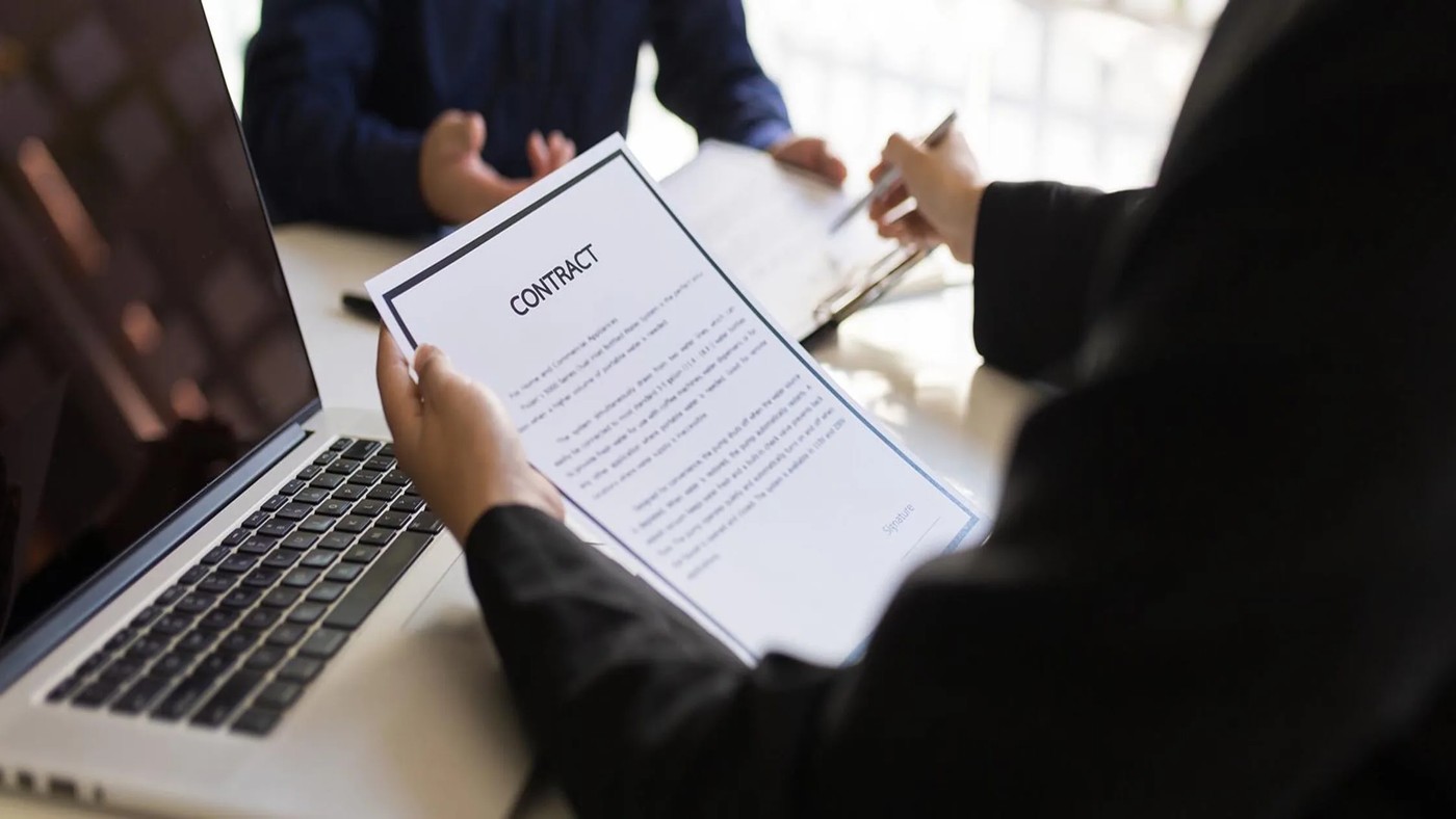 Professional property management team reviewing HUD approval documents